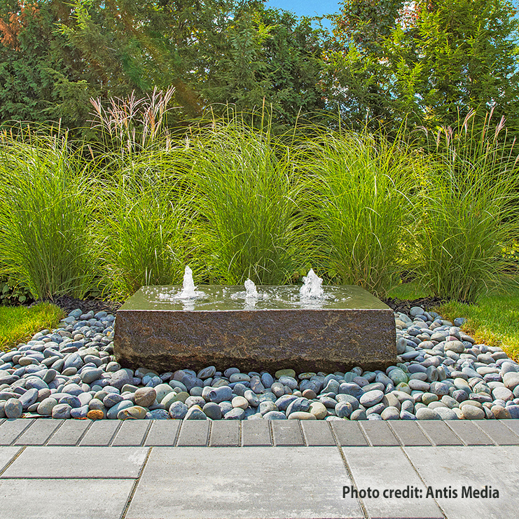 Triad natural stone fountain installation